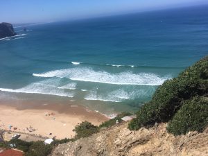 the spectacular view from the waves breaking on the protected beach of arrifana