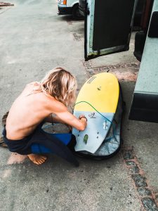 cordoama preparing surfboard