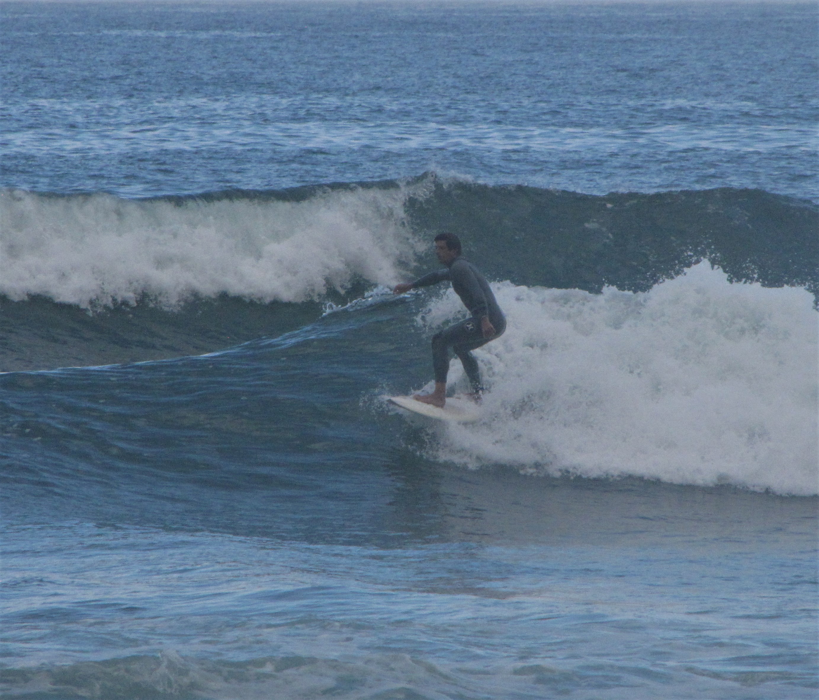 daniel surfing a wave in arrifana