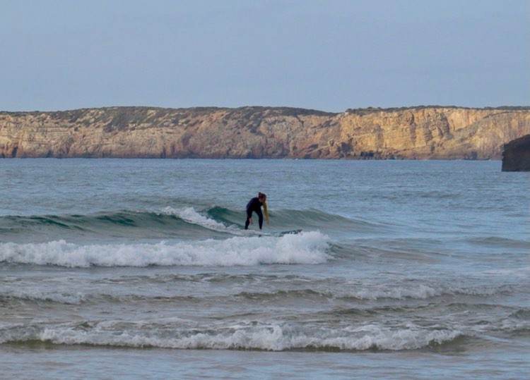 zavial surf girl going left surf guide algarve