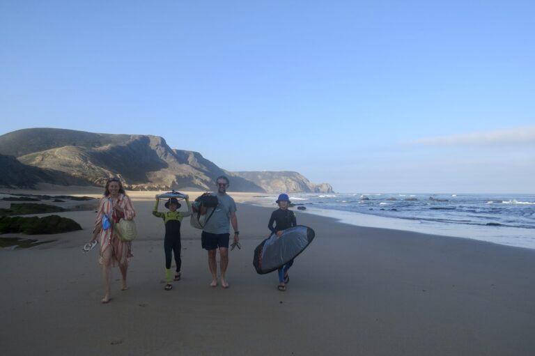 surfing family on the beach surf guide algarve