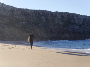 stoked surf guide algarve guest on the beach