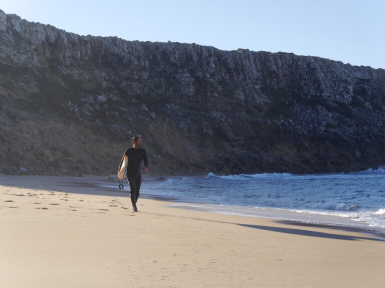 stoked surf guide algarve guest on the beach