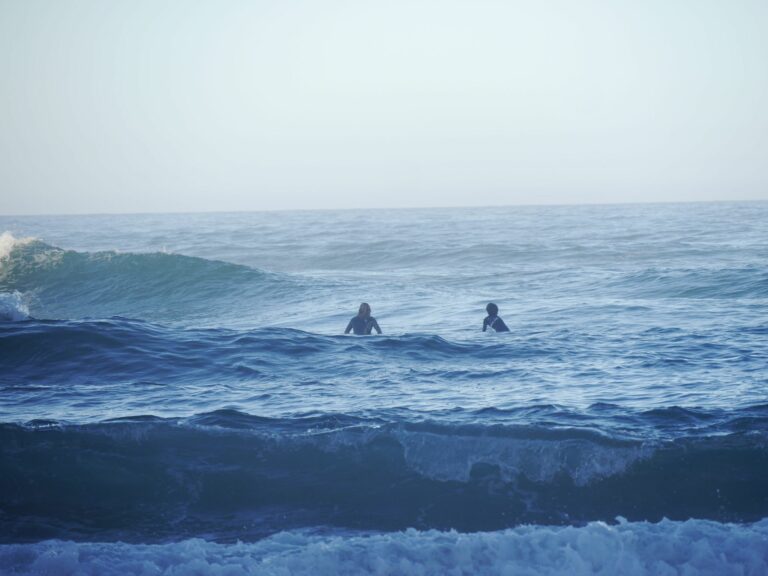 surf guide algarve and guest waiting for the waves castelejo