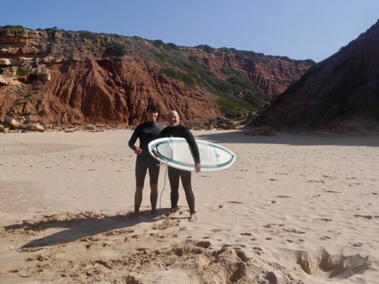 father and son surf guide algarve guests west coast empty beach
