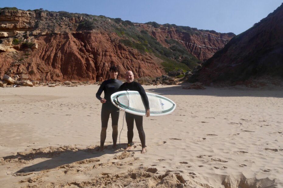 father and son surf guide algarve guests west coast empty beach