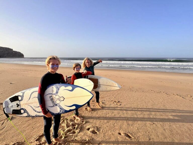 stoked gromms on the beach of zavial surf guide algarve