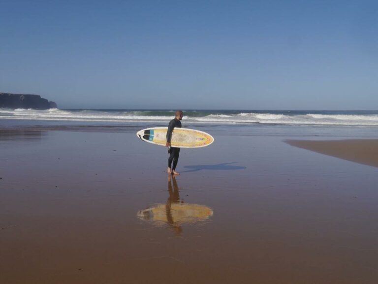 surf guide algarve guest on the beach