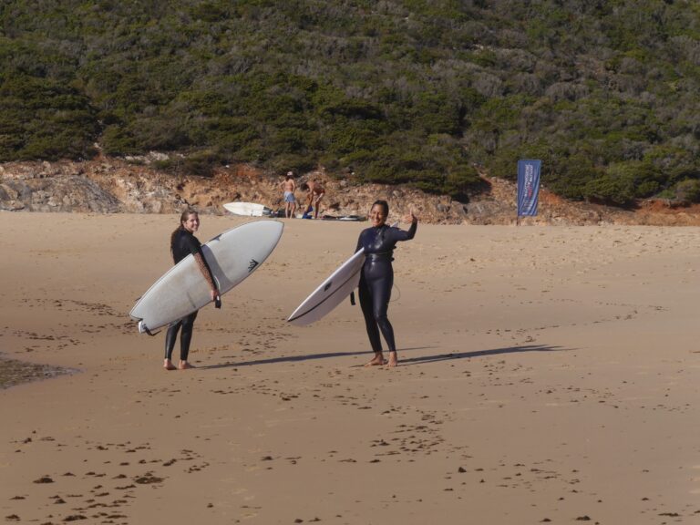 stoked surfer girls on the beach surf guide algarve