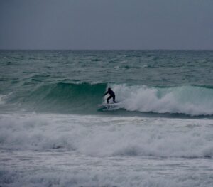 diamond in the rough storm surfing with surf guide algarve
