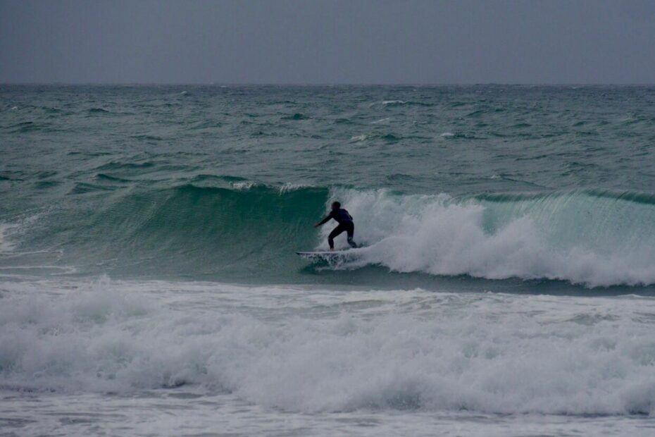 diamond in the rough storm surfing with surf guide algarve