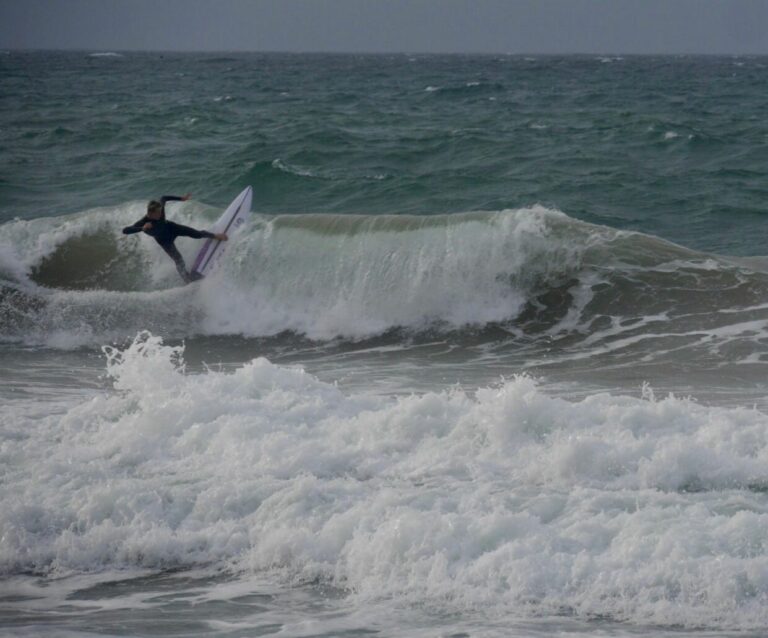 pro kid showing how its done in the storm, surf guide algarve