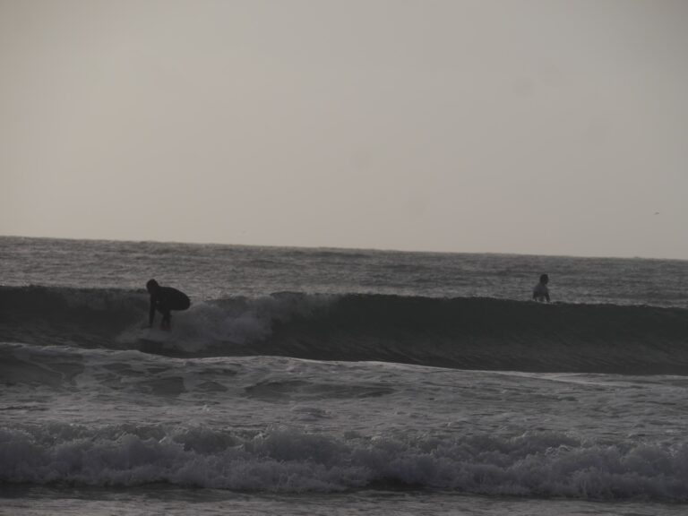 storm chase surfing meia praia surf guide algarve