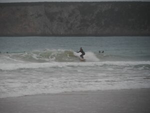 surfing small wave in beliche surf guide algarve