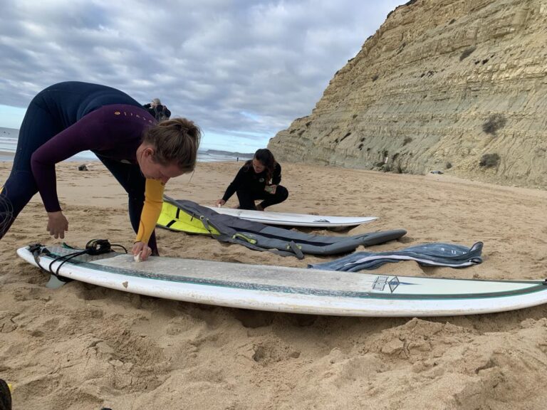 waxing down the midlegnth surfboards surf guide algarve girls