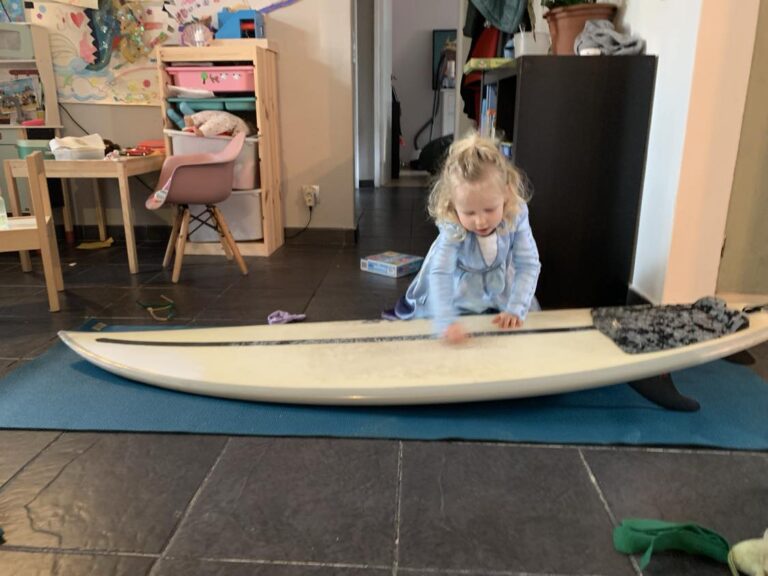 waxing down the surfboard, start m young, surf guide algarve princess