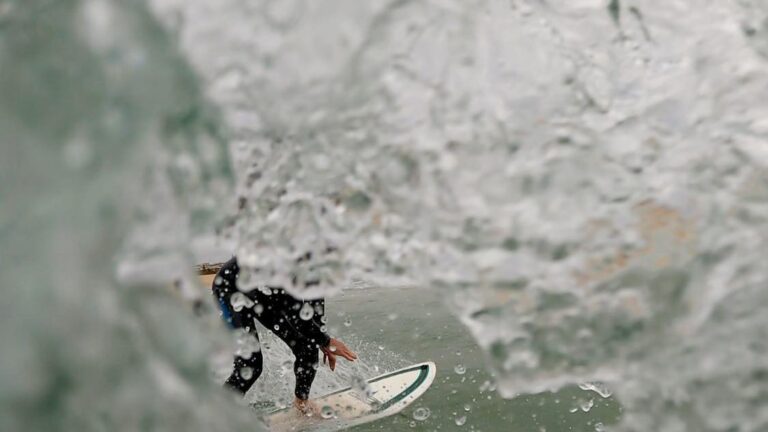 go-pro shot surfing in meia praia lagos