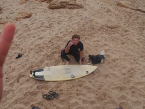 shaka brah surf guide algarve waxing down the surfboard