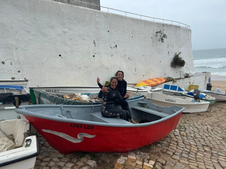 surf guide algarve surfer girls in the boat