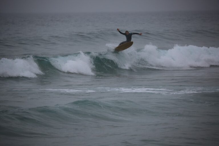 mr surf guide working hard at bordeira beach break