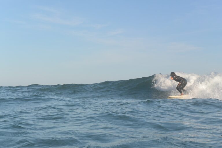 summer waves surfgirl going right surf guide algarve